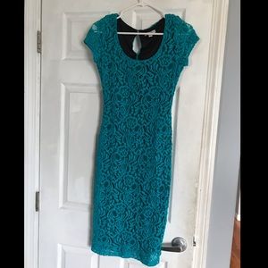 Teal Lace Eva Mendes Dress, below the knee.